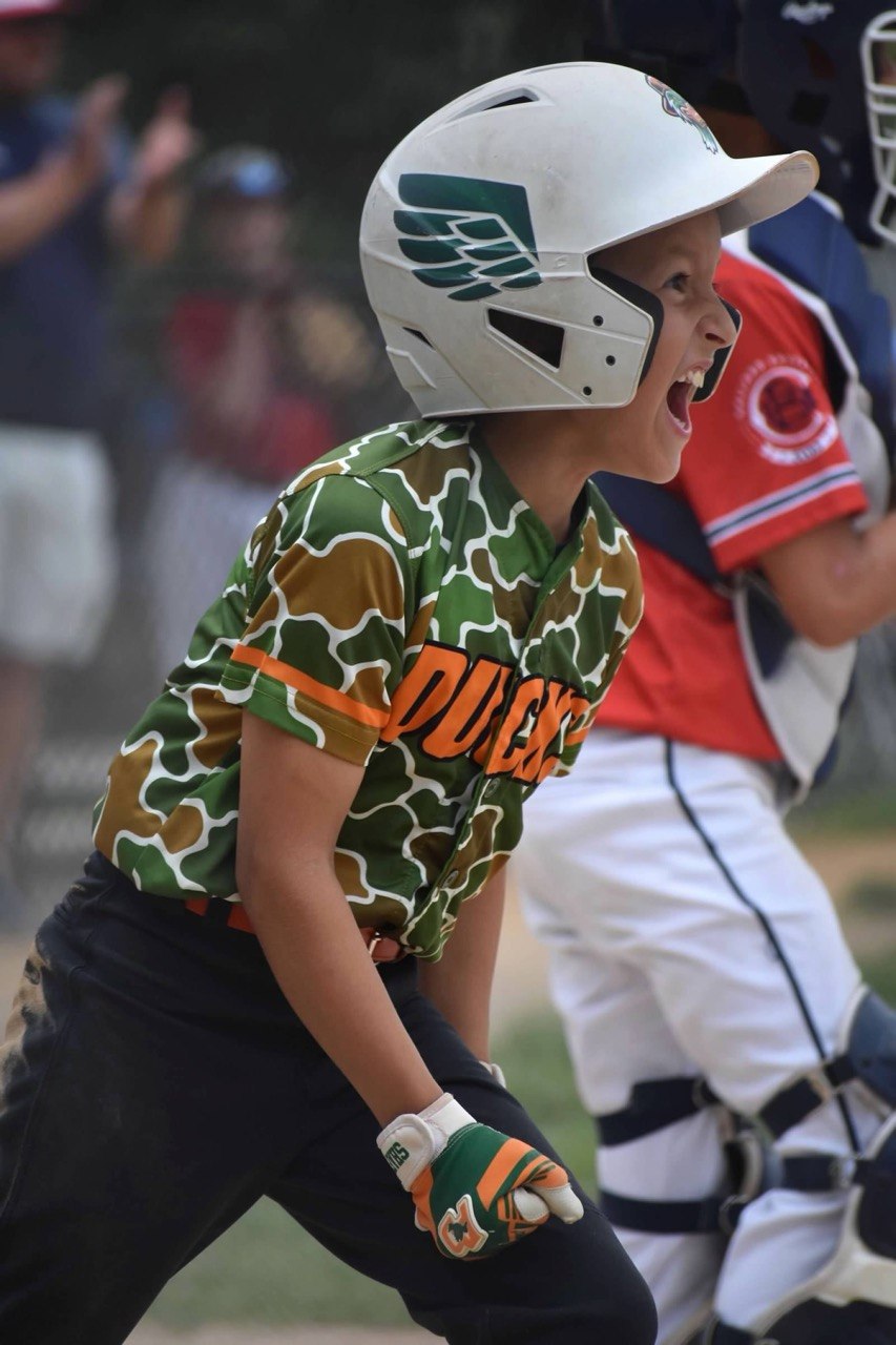 Ankeny Ducks player celebrating a big hit